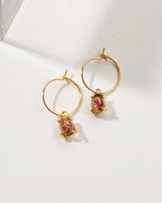 Harness the energizing power of gemstones with these hoop earrings! They create a surprisingly delicate aura, so airy and effortless, you won't even notice them! They look great worn singular or interspersed with larger hoops in your second piercing. Small Hoop Earrings With Natural Stones For Everyday, Everyday Small Hoop Earrings With Natural Stones, Dainty Dangle Hoop Earrings With Gemstones, Small Hoop Earrings With Natural Stones For Gift, Small Hoop Earrings With Natural Stones, Dainty Small Hoop Gemstone Earrings, Second Piercing, Tourmaline Stone, Watermelon Tourmaline