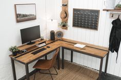 a corner desk with a computer on it