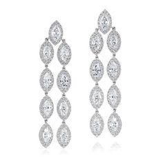 Exquisite, captivating, and refined, this earring duo comprises 18 marquise-cut diamonds, each gracefully encircled by halos made of round diamonds. Diamond Halo Earrings, Round Diamond Halo, Diamonds Direct, Halo Diamond Earrings, Halo Earrings, Marquise Cut Diamond, Marquise Cut, Diamond Halo, High Jewelry