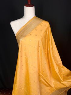 Beautiful Mango Yellow Color Handmade Dupatta with Koniya design and small buttis all over the dupatta, Muted Gold Zari Weaving. Super Light weight and very easy to carry. Can be worn with a Suit or lehenga easily. Please note- : The Color will give a shade of Dark Mango Yellow color in Roomlight and lighter shade of Mango Yellow in Sunlight. Item: DupattaBase color : Mango YellowZari Work : Muted Gold Fabric : Premium quality Banarasi Soft SilkWork : Zari Weaved with tasselsLength of the dupatt Mango Yellow Color, Handmade Dupatta, Indian Dupatta, Mango Yellow, Men's Ethnic Wear, Bandhani Saree, Stole Scarf, Kanjivaram Sarees, Readymade Blouse