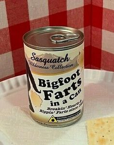 a can of bigfoot farts in a can on a white plate with a red checkered tablecloth