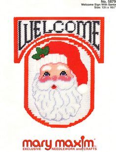 a cross stitch christmas card with a santa clause on it's face and the words welcome