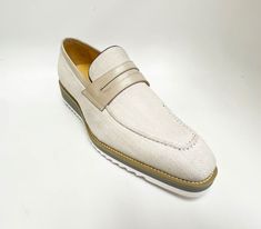 Style: 515-42F-Cream Unique Woven Canvas slip-on Penny Loafer from our Carrucci by Maurice collection features a Calfskin Strap, full Leather Lining, a clean welt and Tricolored Lightweight Rubber Sole! Classic Beige Slip-ons For Office, Formal Beige Slip-ons With Leather Sole, Formal Beige Slip-ons For Spring, Beige Slip-on Business Moccasins, White Almond Toe Slip-ons For Business, Classic Cream Slip-on Moccasins, Beige Formal Slip-ons For Summer, Beige Plain Toe Moccasins With Textured Sole, Cream Leather Slip-ons