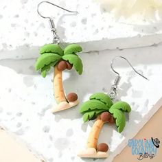 Embrace the tropics and take a risk with our Coconut Multi earrings! Featuring vibrant palm trees, these earrings will add a touch of adventure to any outfit. Show off your bold style with this must-have accessory. Measures 1 1/4" Sold as one pair of earrings. Fun Beach Season Jewelry For Vacation, Fun Drop Earrings For Beach, Green Novelty Jewelry For Summer, Novelty Green Summer Jewelry, Green Novelty Summer Jewelry, Trendy Dangle Earrings For Vacation, Beach Fun Drop Earrings Jewelry, Tropical Green Jewelry For Summer, Summer Tropical Green Jewelry