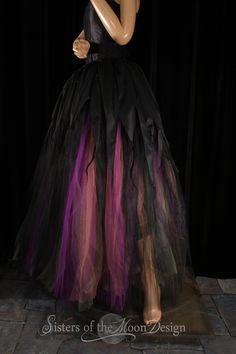 a mannequin wearing a black and purple dress