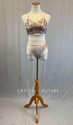 Light Pink camisole bra top is embroidered with floral Rose Gold sequins. Matching Light Pink Lycra trunks have Tan floral applique on left hip. 4.25 Gross of Crystal AB 20ss, Light Silk 9ss and 12ss, and Light Colorado Topaz 9ss, 12ss, and 16ss Rhinestones! **Costume in image is an AS, Photographed on an AS/AM Mannequin with Measurements of: Bust 35", Ribcage 30", Waist 25", Hip 34", Girth 57" Fitted Sequin Bottoms For Dance, Trio Costumes, Pink Camisole, Sequin Jewelry, Gold Sequin Top, Costumes Couture, Sequined Top, Camisole Bra, Light Silk