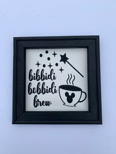 a black and white framed sign with the words bbbiki bobbii brew on it