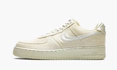 The Stussy x Nike Air Force 1 Low “Fossil” is a Winter 2020 colorway produced by the California streetwear brand and Nike.  Releasing exclusively in Stussy Chapter stores and online, the “Fossil” employs the same neutral cream based design as Stussy’s collaborative Nike Air Zoom Spiridon Caged of the same nickname from Spring 2020.  The “Fossil” employs a rugged canvas material to the entire upper except for the white Swoosh and Stussy embroidery that appears on the mid-panel and toe, respective Stussy Fossil, Yeezy 750, Nike X Travis Scott, Embroidered Heels, Low Air Jordan 1, Custom Air Force 1, Jordan 8, Exclusive Sneakers, Air Force One