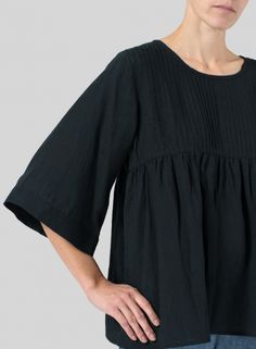 Spring Black Pleated Tops, Black Pleated Tops For Spring, Spring Pleated Short Sleeve Blouse, Pleated Short Sleeve Blouse For Spring, Short Sleeve Pleated Blouse For Spring, Casual Pleated Relaxed Fit Blouse, Fitted Pleated Tops, Chic Pleated Waist Spring Tops, Chic Pintuck Tops For Spring