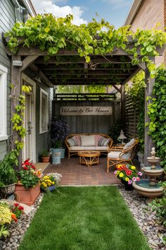 Cozy patio with a pergola covered in greenery, seating area, "Welcome to Our Haven" sign, and colorful flowers. Small Outside Garden Ideas, Small Backyard Ideas No Grass Spaces, Small Backyard Diy Ideas, Backyard Garden Small Spaces, Small Front Yard Seating Area Ideas, Simple Backyard Design Ideas, Simple Small Patio Ideas, Small Urban Backyard Ideas, Small Backyard Renovations