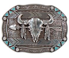 This belt buckle takes inspiration from the Lakota people, known for their buffalo hunting practices. It features an oval shape with small turquoise triangles and berry shapes along the border. In antique silver, it showcases a buffalo skull, feathers, and an arrow in the center. Measuring approximately 3 tall by 4 wide, it can fit belts up to 1 1/2 wide. You can find it in our retail shop in Smyrna, TN, near Nashville, or on our online store. Western Picture Frames, Feather Arrow, Belt Clips, Smith And Western, Western Sculpture, Western Rings, Western Bracelets, Western Prints, Buffalo Skull