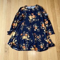 This Is An Old Navy Size Large Dress. It Is Brand New With Tags And Has Not Been Worn. It Is Navy With A Flowered Pattern On It With Long Sleeves. Casual Floral Print Dress For Fall, Casual Fall Floral Print Dress, Blue Long Sleeve Casual Floral Dress, Blue Printed Mini Dress For Fall, Blue Floral Print Dress For Fall, Blue Flower Dress, Blue Floral Print Dress, Blue Print Dress, Lavender Dresses