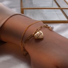 "Adorn yourself or your bridesmaids with our Personalized Mother of Pearl Bracelet. With a heart charm and minimalist design, it's a heartfelt and stylish jewelry gift. Embrace elegance and sentimentality with our customizable bracelet. #YOU MAY LIKE THIS Dainty rose gold slider bracelet https://www.etsy.com/listing/1486513550/dainty-rose-gold-slider-bracelet Engraved Paperclip Silver Heart Bracelet https://www.etsy.com/listing/1497885357/engraved-paperclip-silver-heart-bracelet # HOW TO ORDER 1 Minimalist Metal Charm Bracelet For Valentine's Day, Valentine's Day Minimalist Metal Charm Bracelet, Heart-shaped Metal Bracelets For Wedding, Heart Shaped Metal Bracelets For Wedding, Elegant Wedding Charm Bracelet With Heart Charm, Elegant Wedding Chain Bracelet With Heart Charm, Gold Metal Heart Bracelet For Wedding, Minimalist Charm Bracelet For Bridesmaids, Dainty Metal Charm Bracelet For Valentine's Day