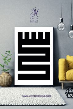 a black and white art print sitting on top of a rug next to a yellow chair