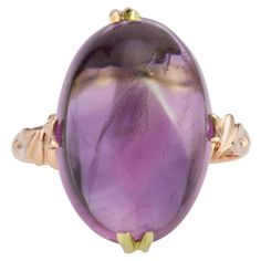 Handmade 1940's oval cabochon 13.00 carat natural amethyst with moderate inclusions, in a 14k yellow gold setting. 1 oval cabochon purple amethyst, MI approx. 13.00cts Size 7.25 and sizable 14k yellow gold Stamped: 14k 4.9 grams Width at top: 19.3mm Height at top: 11.9mm Width at top: 2.1mm Mesmerizing Beauty, Diamond Collection, Amethyst Gold, Cabochon Ring, Yellow Gold Setting, 18k Yellow Gold Ring, Domed Ring, Yellow Gold Earring, Gold Earrings Dangle