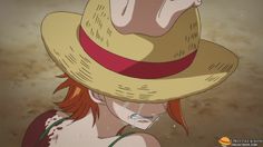 a woman with red hair wearing a straw hat