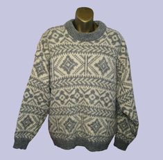 DESCRIPTION HEATHER & TWEED WOMEN’S SWEATER NORDIC INSPIRED GRAY/CREAM WOOL/ALPACA SIZE: LARGE Heather and Tweed modern Nordic inspired sweater, made of a very soft, high quality,  80% wool and 20% alpaca blend in gray and cream. This sweater is thick and beautifully knit, with a lovely stitch in a geometric snowflake pattern. This Heather and Tweed woolen garment is knitted using the highest quality materials, soft, thick, cozy, guaranteed to keep you warm.  Chunky, dense wool with a full cut, Gray Nordic Sweater For Fall, Gray Fair Isle Sweater For Fall, Vintage Gray Winter Sweater, Vintage Gray Sweater For Winter, Gray Wool Sweater With Fair Isle Pattern, Gray Fair Isle Pattern Sweater For Cold Weather, Cozy Gray Sweater With Fair Isle Pattern, Gray Fair Isle Sweater For Cold Weather, Geometric Snowflake