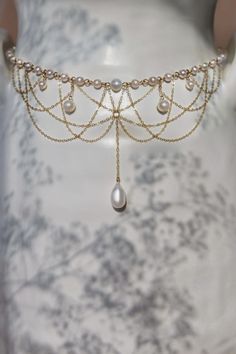 The Diane Pearl Necklace is intricately handcrafted with 14k gold-filled chain and freshwater pearls dangling elegantly from a strand of scintillating connected freshwater pearls. Preorder 7-10 days send out. 40cm/16 inches in length. Packaged in an elegant plastic-free reusable jewelry box, this necklace makes the perfect gift or special treat for oneself. Note: This very intricate necklace can tangle even with our utmost care in sending, please be gentle and patient to untangle and place in th Diy Freshwater Pearl Necklace, Waistband Jewellery, Wedding Necklaces For Bride, Pearl Jewelry Aesthetic, Pearl Shoulder Jewelry, Fantasy Jewelry Necklace, Pearl Necklace Aesthetic, Intricate Necklace, Celestial Fashion