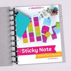 the sticky note book is organized with colorful stickers