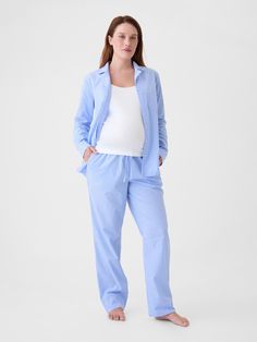 Soft cotton poplin maternity pajama shirt and pants set.  Notch collar.  Long sleeves.  Button front.  Elasticized waist at PJ pants.  Front slant pockets.  Allover stripes.  Please note: Maternity styles cannot be returned in store.  Please enjoy free returns by mail.  This product was made in a factory that invests in gender equality and women’s empowerment.  Through RISE Reimagining Industry to Support Equality) and Gap Inc. ’s program P. A. C. E.  Personal Advancement & Career Enhancement), Maternity Styles, Shirt And Pants Set, Maternity Pajamas, Gap Maternity, Gender Equality, Support People, Pj Pants, Notch Collar, Pajama Shirt