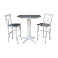 a white table and two chairs sitting next to each other