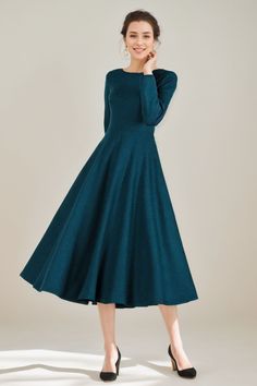 This elegant Green Wool Fit & Flare Long Dress for Women is the perfect addition to your wardrobe. The premium wool material provides exceptional warmth and comfort while the fit & flare design flatters your figure. With a stylish green color, this dress is perfect for any occasion. Fit Flare Dress Winter, Fitted A-line Maxi Dress For Fall, Elegant Full Skirt Dress For Fall, Elegant A-line Winter Maxi Dress, Winter Long Sleeve Fit And Flare Dress, Winter Fit And Flare Dress With Long Sleeves, Fit And Flare Long Sleeve Winter Dress, Fitted Long Sleeve A-line Dress For Winter, Fall A-line Fitted Maxi Dress