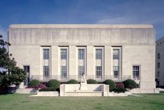 a large building with many windows on the front and side of it's facade