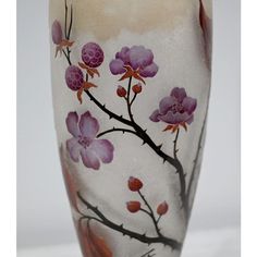 a vase with pink flowers painted on it