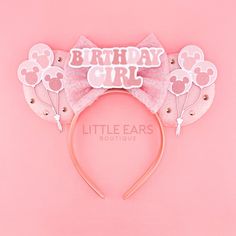 a minnie mouse ears headband with the words birthday girl on it