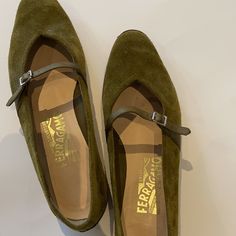 Ferragamo Women’s Army Green Flat Mary Janes With A Tiny Buckle Closure. Leather Sole And Small Heel. Item Is Pre-Owned And Is In Good Condition. Flat Mary Janes, Green Flats, Salvatore Ferragamo Shoes, Ferragamo Shoes, Ferragamo Flats, Mary Jane Flats, Green Suede, Green And Brown, Salvatore Ferragamo