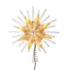 a gold and silver star ornament hanging from a wire on a white background