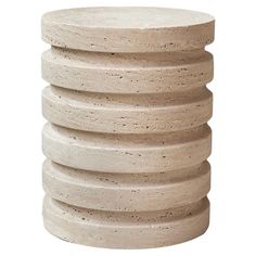 a stack of stacked concrete discs on a white background