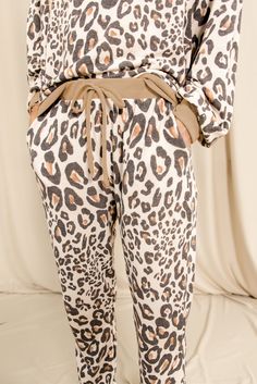 Leopard Print Long Sleeve Top and Drawstring Pants Loungewear Drawstring Pants For Winter Lounging, Winter Drawstring Pants For Lounging, Casual Bottoms For Pajama Party In Fall, Trendy Elastic Waistband Sleepwear For Loungewear, Casual Pants For Fall Pajama Party, Trendy Drawstring Bottoms For Loungewear, Casual Leopard Print Sleepwear For Loungewear, Fall Leopard Print Bottoms With Elastic Waistband, Fall Lounging Sleepwear With Elastic Waistband