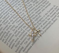 Double Cross Necklace in Silver or Gold Plating This exquisite double cross necklace, available in either silver or gold plating, makes a perfect gift for baptisms, first communions, or any special religious occasion. Its elegant design also suits everyday wear, adding a touch of grace to any outfit. - Length: 16 inches with a 2-inch extender - Material: Silver or gold plating - Perfect for: Baptism, First Communion, Confirmation, everyday wear Cute Silver Cross Necklace, Dainty Gold Cross Necklace, Cross Necklace Aesthetic, Cross Necklace Gold, Cross Decor, Silver Cross Necklace, Catholic Jewelry, Mini Cross, Religious Cross