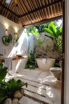 a bathroom with a tub, sink and toilet in it's own outdoor area