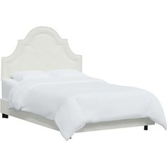 a bed with white linens and a headboard on it's side, against a white background