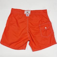 Vtg Birdwell Beach Britches Men's Size 30-31 Board Shorts Bright Red Orange Usa. Bright Red/Orange Color! Size Tag Is Washed But Measurements Would Indicate The Size Would Have Been Around 30-31 As Shown Tied In The Photo. Above The Knee, High Waisted Style, No Stretch In The Waist. Measurements Below To Ensure Proper Fit! Weighs: 4.7oz Measurements, Laying Flat: Waist Width, Edge To Edge: 15.5” Inseam: 5” Outseam (Side Length Top To Bottom): 15.5” Rise: 12” Red Vacation Bottoms With Pockets, Red Bottoms With Pockets For Vacation, Red Swim Trunks With Pockets For Swimming, Orange Short Length Swim Trunks For Vacation, Summer Orange Shorts With Pockets, Orange Summer Shorts With Pockets, Retro Vacation Bottoms With Pockets, Retro Bottoms With Pockets For Vacation, Retro Red Beach Shorts