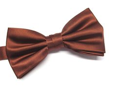 "Beautiful silk pre tied and adjustable double tiered banded bow tie. Will adjust from 13\" through 20\" neck. Bow dimensions 2.5\" x 4.5\"." Adjustable Satin Bow Tie For Formal Occasions, Satin Standard Tie Bow, Elegant Brown Bow Ties, Adjustable Brown Tie For Black Tie Events, Classic Brown Bow Tie, Elegant Brown Bow Tie With Bow Tie Back, Elegant Brown Bow Tie With Satin Bow, Elegant Brown Bow Tie Suit Accessories, Elegant Brown Suit And Tie Accessories With Bow Tie