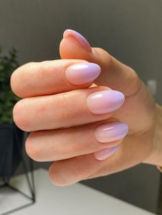 a woman's hand with long, pink nails