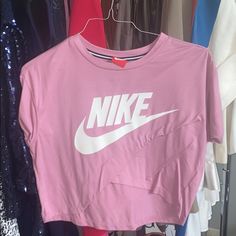 Never Worn Nike Pink Women’s Shirt. Size Medium. Nike Pink Top With Logo Print, Nike Spring Short Sleeve Tops, Nike Tops With Logo Print For Spring, Nike Trendy Top For Spring, Nike Short Sleeve Tops For Spring, Trendy Pink Nike Tops, Nike Sporty Shirt For Spring, Sporty Logo Print Shirt For Spring, Nike Sporty Spring Shirt