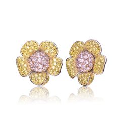 These dainty flower knob earrings are the perfect way to add beauty to any outfit. A pink cubic zirconia cluster is at the center, surrounded by yellow cubic zirconia clusters. This makes a beautiful Gift. Wipe To Clean Item should not come in contact with water. Fine Jewelry Flower Earrings In Cubic Zirconia, Fine Jewelry Flower Earrings With Cubic Zirconia, Fine Jewelry Flower-shaped Cubic Zirconia Earrings, Pink Cubic Zirconia Flower-shaped Earrings, Pink Cubic Zirconia Flower Shaped Earrings, Fine Jewelry Flower-shaped Cluster Earrings In Cubic Zirconia, Luxury Cubic Zirconia Flower Earrings, Luxury Flower Cluster Earrings, Pakistani Bridal Jewelry