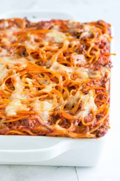 a casserole dish with meat and cheese on it, ready to be eaten