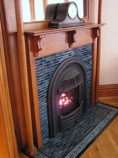 a fireplace with a clock sitting on top of it