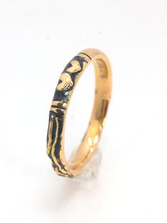 This is the most narrow of my Memento Mori rings at 3mm wide and is cast in 14k rich yellow gold. The Skeleton is flanked by intertwined hearts on one side.14k rich yellow gold and EnamelMade to Order. Usually ships in 3-5 days.This ring looks great as part of a stack, as a wedding band, a right-hand ring, or a promise ring, and all by its damn self, thank you very much. And as always, my rings are Unisex. Y’all wear what you want!I made these Memento Mori rings for my older sister Jill, a famou Hand Forged 14k Gold Engraved Promise Ring, 14k Gold Hand Forged Engraved Ring For Anniversary, Hand Forged Yellow Gold Engraved Promise Ring, Hand Forged 14k Gold Engraved Ring For Anniversary, Anniversary Hand Forged 14k Gold Engraved Ring, Hand Forged Gold Engraved Promise Ring, Hand Forged Yellow Gold Engraved Ring For Anniversary, Hand-forged Yellow Gold Engraved Ring For Anniversary, Yellow Gold Stackable Promise Rings In Recycled Gold