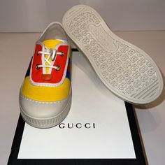 New With Tag/Box Size 28 Has A Small Stain On The Left Shoe But It Can Be Removed Gucci Yellow Sneakers For Streetwear, Yellow Gucci Sneakers For Streetwear, Gucci Yellow Streetwear Sneakers, Gucci Sneakers With Vulcanized Sole, Gucci Multicolor Sneakers With Rubber Sole, Multicolor Gucci Sneakers With Rubber Sole, Yellow Sneakers With Elastic Laces And Round Toe, Gucci Yellow Low-top Sneakers, Yellow Casual Sneakers With Elastic Laces