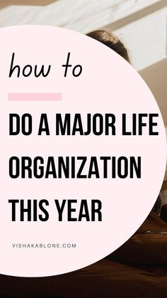 a woman sitting on her bed with the words how to do a major life organization this year