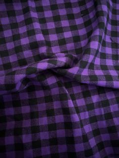 a purple and black checkered fabric