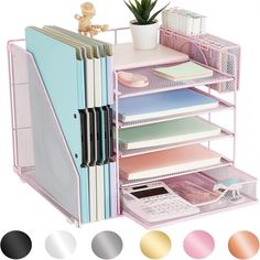 a pink desk organizer with lots of files and folders on it's sides