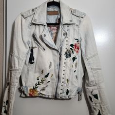 Gorgeous Jean Jacket, Was Worn Once, Brand New Condition.Too Small Otherwise I Would Leave It. Size Small Winter White Outerwear With Floral Embroidery, White Floral Embroidered Winter Outerwear, Winter Embroidered Long Sleeve Biker Jacket, Embroidered Long Sleeve Biker Jacket For Winter, Embroidered Winter Biker Jacket With Long Sleeves, Embroidered Long Sleeve Biker Jacket For Fall, Casual Embroidered Winter Biker Jacket, Embroidered Biker Jacket With Long Sleeves For Winter, Casual Long Sleeve Biker Jacket With Floral Embroidery