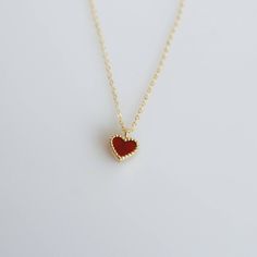 Tiny and dainty red agate heart filled with love and passion, such a perfect present for Valentine's Day and your loved ones. :: Style name: RDHRT-ENLN1034 :: Heart size: 7x7.5mm :: Material: 14k solid yellow gold :: Stone type: red agate Notes :: Jewelries are measured in millimeters and centimeters. :: Please read store policy before placing order. :: In stock items are ready to ship in 3 business days, made to order items are ready to ship in 2-4 weeks. :: International Shipping AVAILABLE. :: 14k Gold Charm Necklace For Valentine's Day Gift, Red Sterling Silver Necklace With Heart Pendant, Elegant Red Heart Pendant Jewelry, Elegant Red Heart Necklace For Mother's Day, Valentine's Day Jewelry Gift With Heart Detail, Red Heart Pendant Jewelry For Mother's Day, Elegant Red Necklaces For Valentine's Day, Minimalist Red Heart-shaped Jewelry, Valentine's Day Fine Jewelry Charm Pendant Necklace